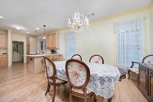 dining room with light wood-type flooring, visible vents, recessed lighting, a notable chandelier, and crown molding