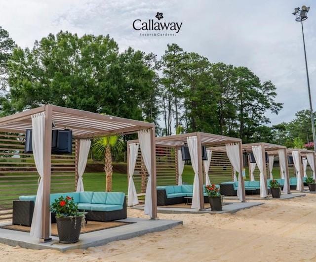 view of property's community with a pergola, an outdoor hangout area, a patio area, and stairway