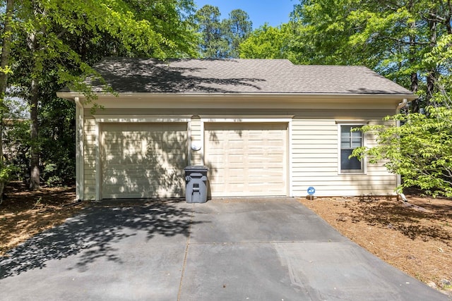 garage with aphalt driveway