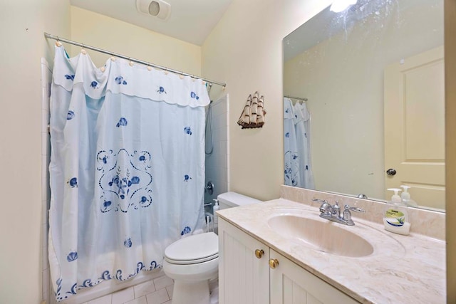 full bathroom featuring tile patterned floors, shower / tub combo with curtain, vanity, and toilet
