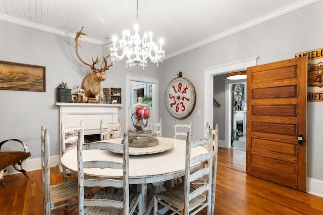 17779 Main St, Woodbury, GA 30293 - dining room featuring a chandelier, wood finished floors, and ornamental molding