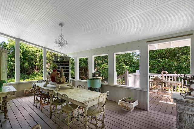 17779 Main St, Woodbury, GA 30293 - sunroom / solarium with outdoor dining space and a chandelier