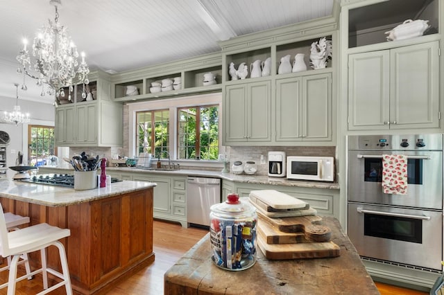 17779 Main St, Woodbury, GA 30293 - kitchen featuring open shelves, stainless steel appliances, a sink, a chandelier, and crown molding