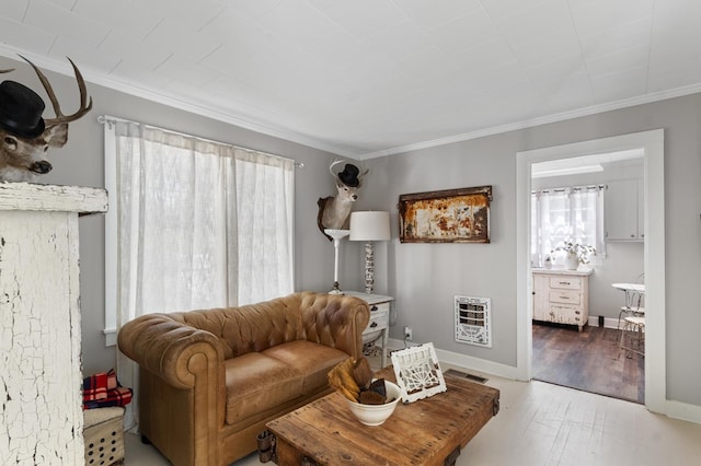 17779 Main St, Woodbury, GA 30293 - living area featuring heating unit, crown molding, wood finished floors, and baseboards