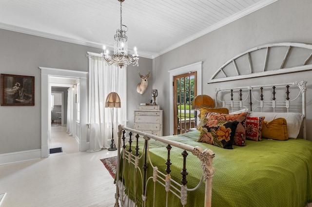 17779 Main St, Woodbury, GA 30293 - bedroom with a chandelier, wood finished floors, crown molding, and baseboards
