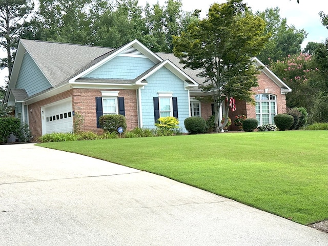 4804 Champions Way, Columbus, GA 31909 - view of front of house featuring an attached garage, a front yard, concrete driveway, and roof with shingles
