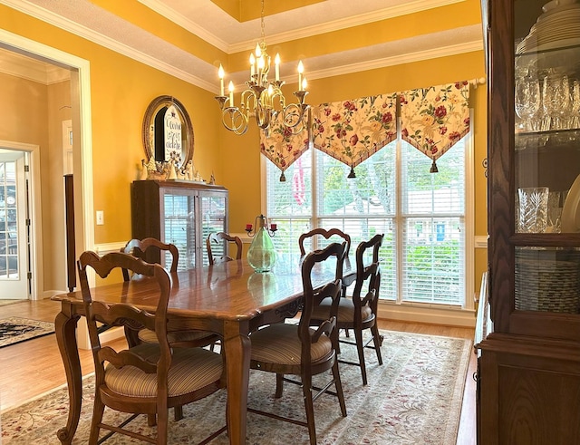 4804 Champions Way, Columbus, GA 31909 - dining space featuring light wood-style flooring, crown molding, healthy amount of natural light, and a chandelier