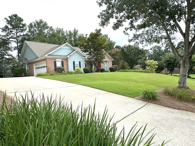4804 Champions Way, Columbus, GA 31909 - view of front of house featuring an attached garage, a front lawn, concrete driveway, and brick siding