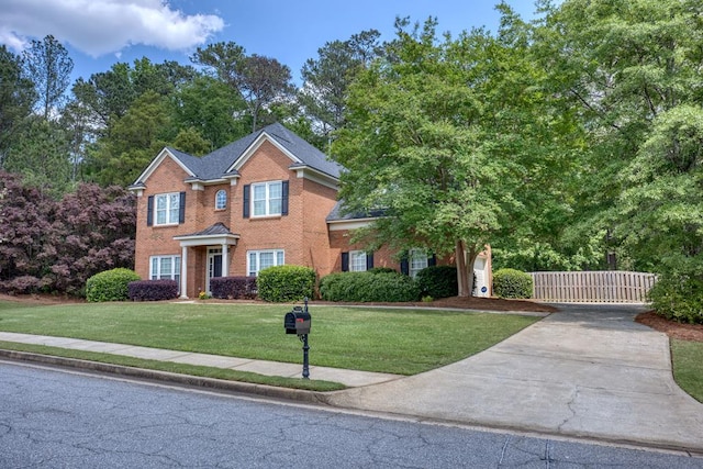 4589 Carnoustie Ln, Columbus, GA 31909 - view of front of house featuring brick siding, driveway, and a gate