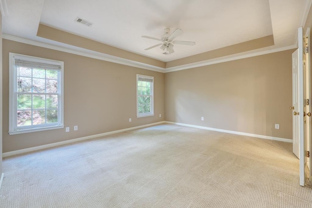 4589 Carnoustie Ln, Columbus, GA 31909 - spare room with a raised ceiling, light colored carpet, baseboards, a ceiling fan, and ornamental molding