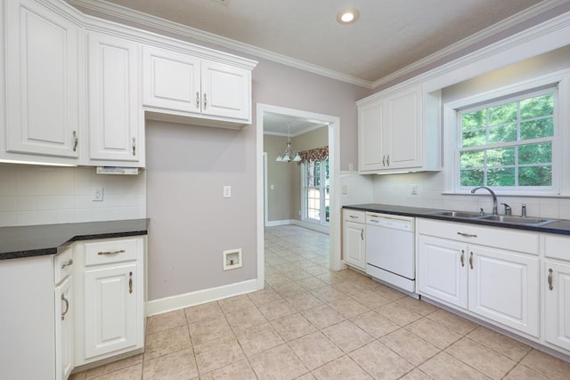 4589 Carnoustie Ln, Columbus, GA 31909 - kitchen with a sink, white dishwasher, ornamental molding, dark countertops, and a chandelier