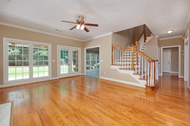 4589 Carnoustie Ln, Columbus, GA 31909 - unfurnished living room featuring wood finished floors, stairway, french doors, a ceiling fan, and ornamental molding