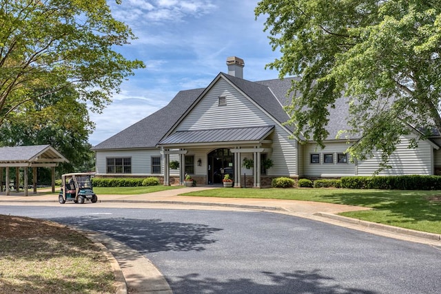 4589 Carnoustie Ln, Columbus, GA 31909 - view of front of property with a front yard, a chimney, and a shingled roof