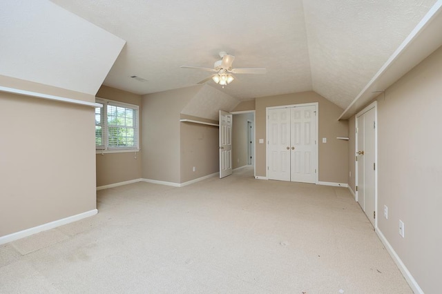 4589 Carnoustie Ln, Columbus, GA 31909 - additional living space with a ceiling fan, light colored carpet, vaulted ceiling, and baseboards
