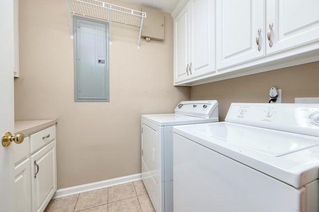 4589 Carnoustie Ln, Columbus, GA 31909 - washroom featuring electric panel, washer and clothes dryer, baseboards, cabinet space, and light tile patterned flooring