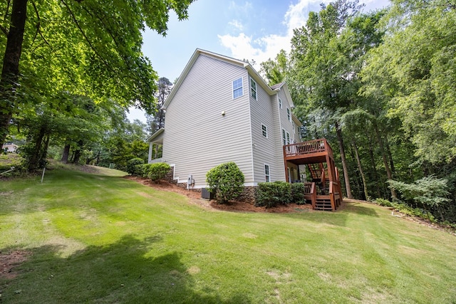6027 Wellesley Dr, Columbus, GA 31904 - view of side of home featuring a wooden deck, a lawn, and stairway