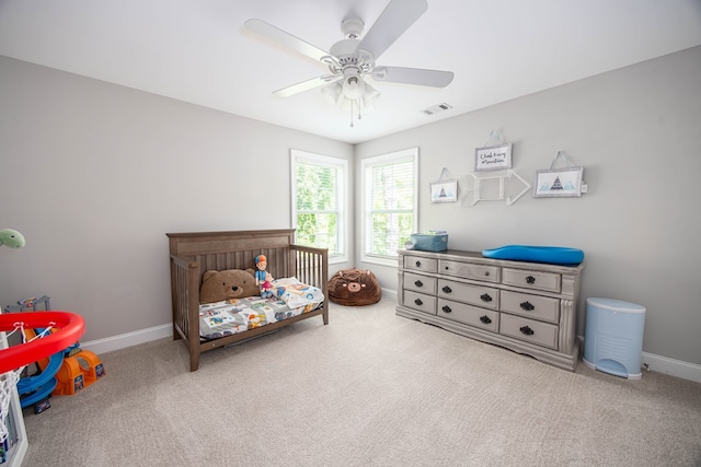 6027 Wellesley Dr, Columbus, GA 31904 - bedroom featuring carpet, baseboards, a crib, and a ceiling fan