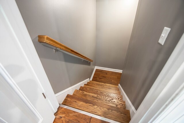 6027 Wellesley Dr, Columbus, GA 31904 - staircase with baseboards and wood finished floors