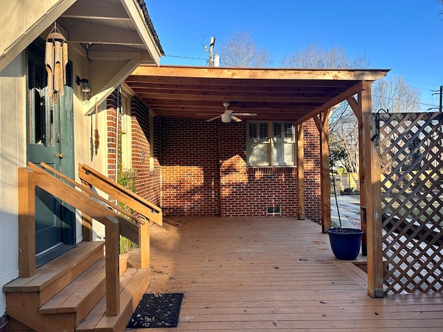 wooden deck featuring ceiling fan