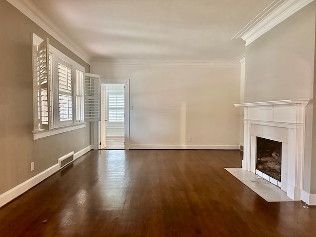 unfurnished living room with dark hardwood / wood-style floors and ornamental molding