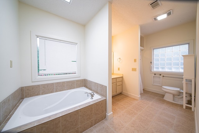 5604 Holland Dr, Columbus, GA 31909 - bathroom with toilet, vanity, tiled bath, a shower, and tile patterned floors