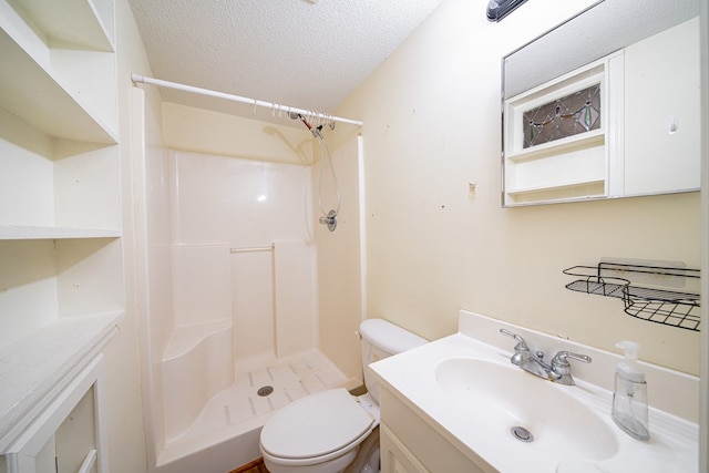 5604 Holland Dr, Columbus, GA 31909 - full bathroom featuring a stall shower, toilet, a textured ceiling, and vanity