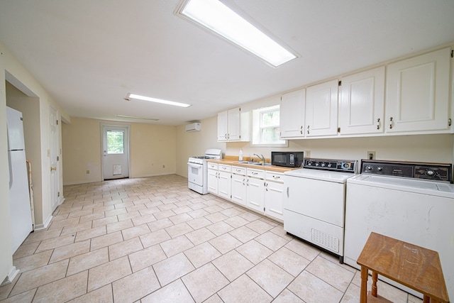 5604 Holland Dr, Columbus, GA 31909 - laundry room with a wall mounted air conditioner, washer and clothes dryer, and baseboards