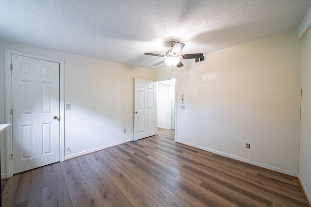 5604 Holland Dr, Columbus, GA 31909 - unfurnished bedroom featuring wood finished floors, baseboards, a textured ceiling, and a ceiling fan