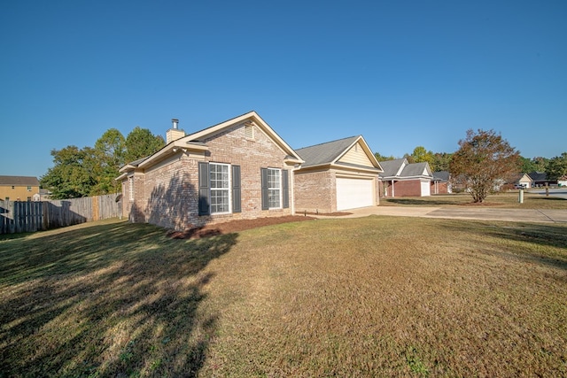 ranch-style house with a garage and a front yard