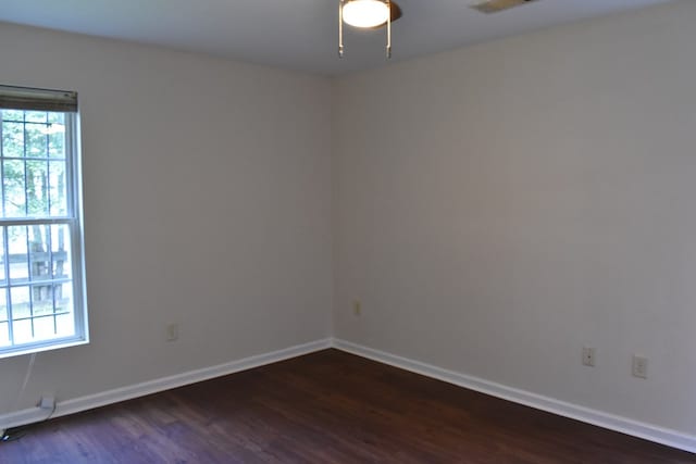 empty room featuring dark hardwood / wood-style floors