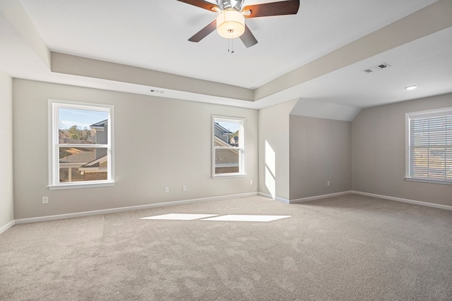 unfurnished room featuring lofted ceiling, light colored carpet, and ceiling fan