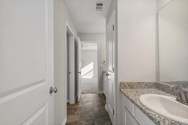 bathroom with vanity and ceiling fan