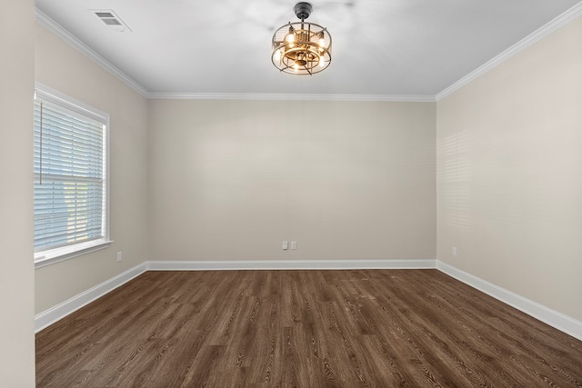 empty room with dark hardwood / wood-style flooring and crown molding