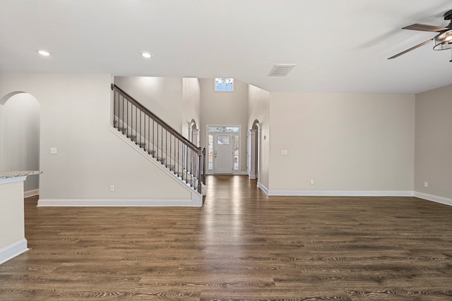 interior space featuring ceiling fan and dark hardwood / wood-style floors