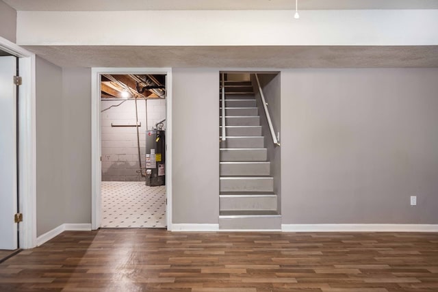 5906 Forrest Rd, Columbus, GA 31907 - finished basement featuring water heater, wood finished floors, and stairway