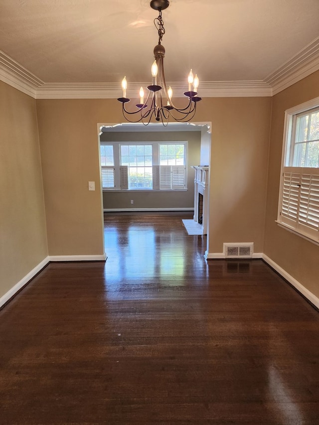 1640 Preston Dr, Columbus, GA 31906 - unfurnished dining area featuring a chandelier, healthy amount of natural light, crown molding, and wood finished floors