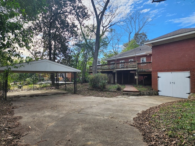 1640 Preston Dr, Columbus, GA 31906 - view of yard featuring concrete driveway, a carport, and a wooden deck