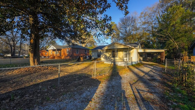 single story home with covered porch and a carport