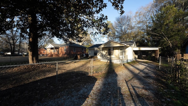 single story home with covered porch and a carport