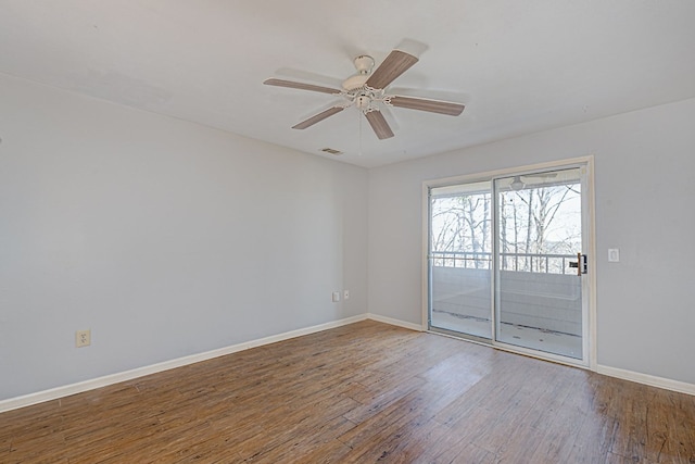 unfurnished room with wood-type flooring, visible vents, baseboards, and a ceiling fan