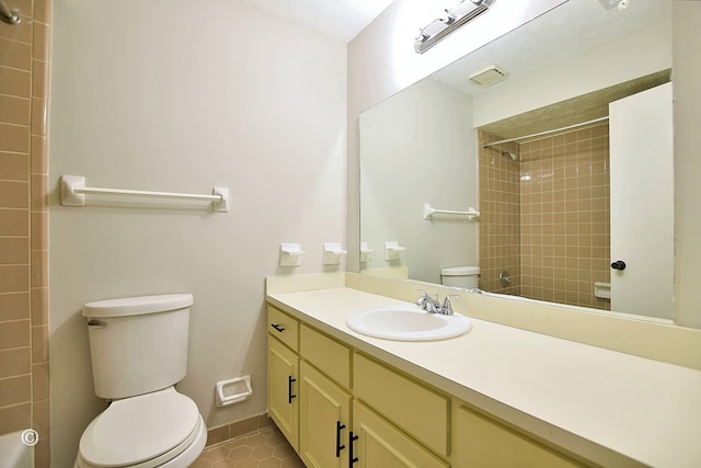 full bath featuring tile patterned flooring, baseboards, walk in shower, toilet, and vanity