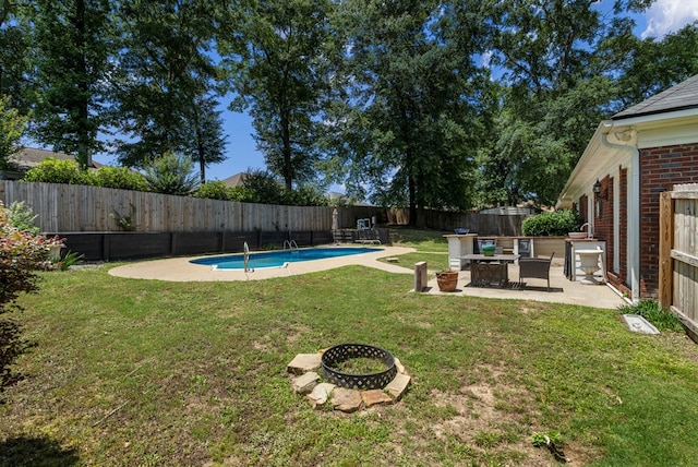 7310 Westport Loop, Midland, GA 31820 - view of yard featuring an outdoor fire pit and a patio area