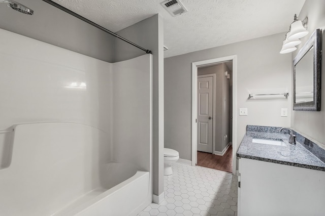 7310 Westport Loop, Midland, GA 31820 - bathroom with toilet, vanity, bathing tub / shower combination, tile patterned flooring, and a textured ceiling