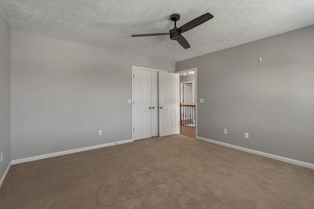 7310 Westport Loop, Midland, GA 31820 - unfurnished bedroom with a textured ceiling, carpet, and baseboards