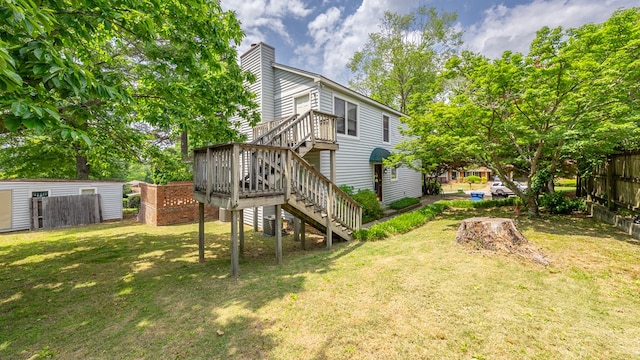 view of yard featuring stairs and a deck