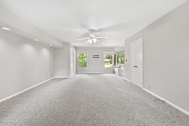 empty room with a ceiling fan, carpet, baseboards, and recessed lighting