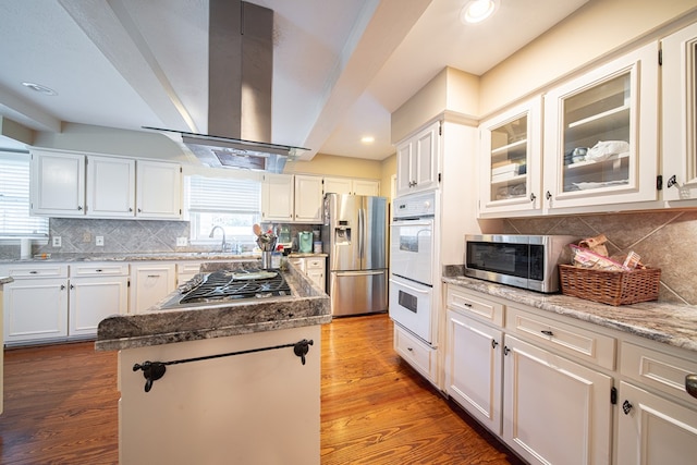 6130 Bristol Blvd, Columbus, GA 31904 - kitchen with appliances with stainless steel finishes, ventilation hood, a center island, tasteful backsplash, and recessed lighting