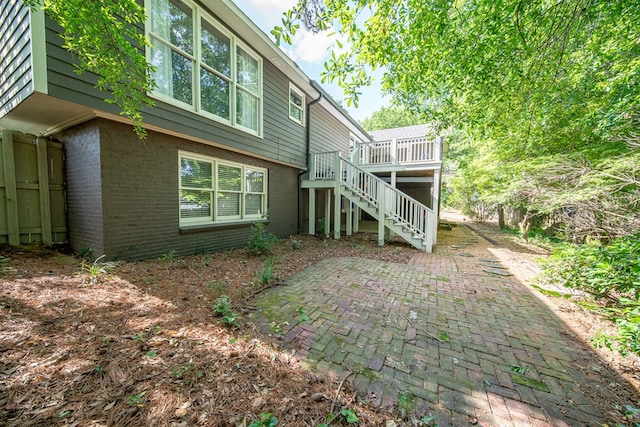 6130 Bristol Blvd, Columbus, GA 31904 - back of house featuring brick siding, stairway, a deck, and a patio area