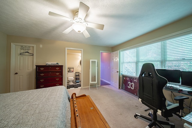6130 Bristol Blvd, Columbus, GA 31904 - bedroom featuring carpet, a textured ceiling, an office area, ceiling fan, and ensuite bath