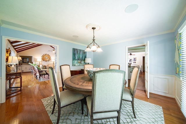 6130 Bristol Blvd, Columbus, GA 31904 - dining room with wood finished floors, ceiling fan, wainscoting, ornamental molding, and vaulted ceiling